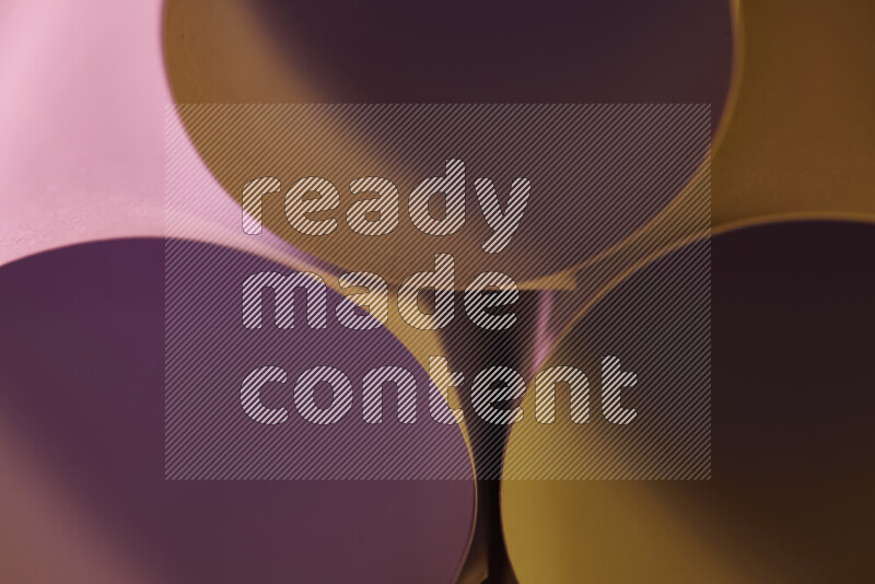 The image shows an abstract paper art with circular shapes in varying shades of pink and warm tones