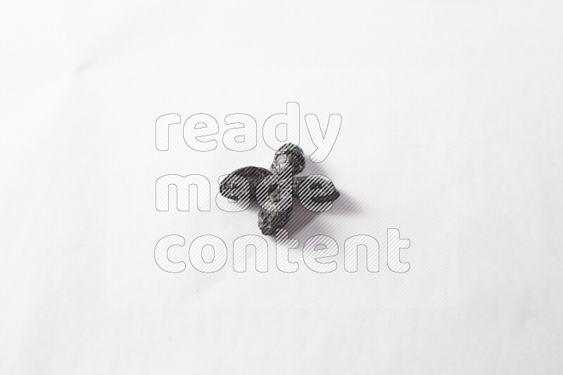 Dried plums on white background