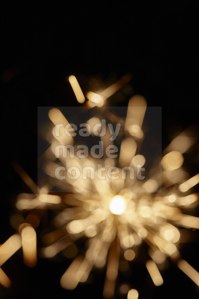A close-up image of sparkler candle isolated on black background