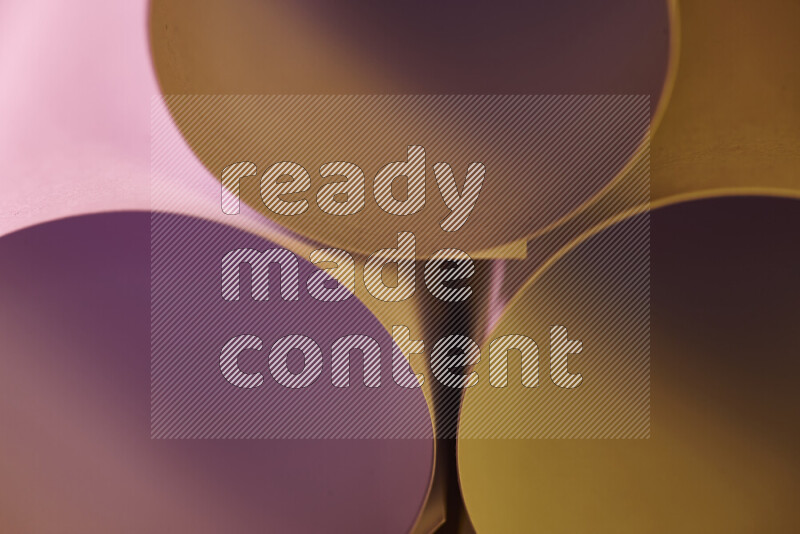 The image shows an abstract paper art with circular shapes in varying shades of pink and warm tones