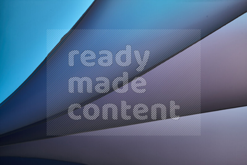 An abstract art piece displaying smooth curves in cold gradients created by colored light