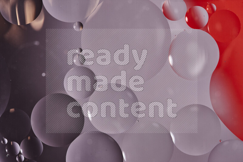 Close-ups of abstract oil bubbles on water surface in shades of white and red