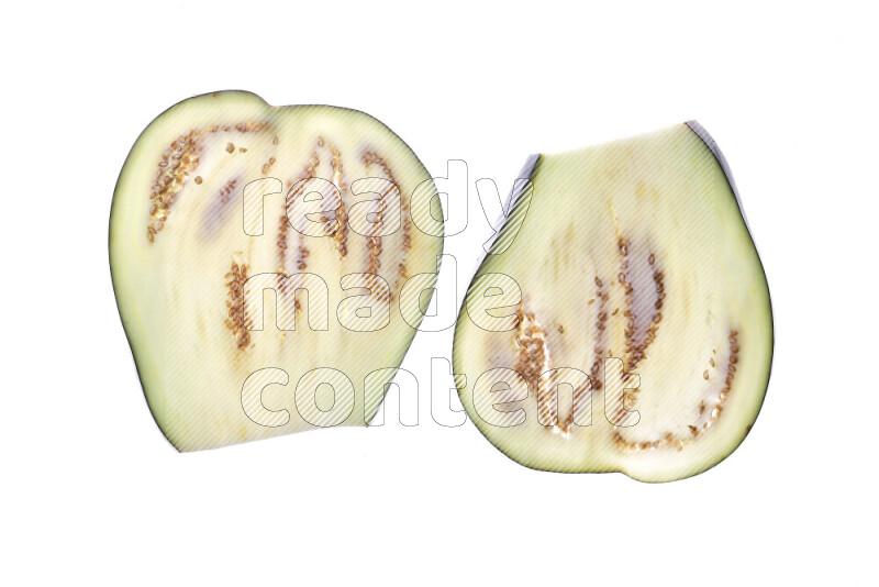 Eggplant slices on illuminated white background