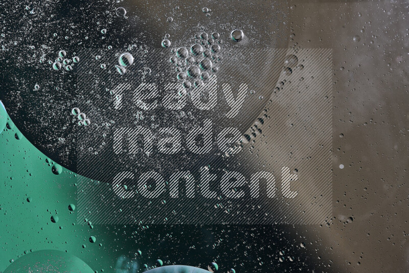 Close-ups of abstract oil bubbles on water surface in shades of green and brown