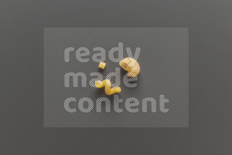 Different pasta types on grey background