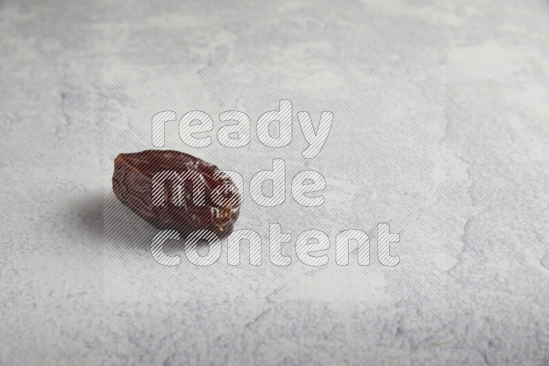 one madjoul date on a light grey background