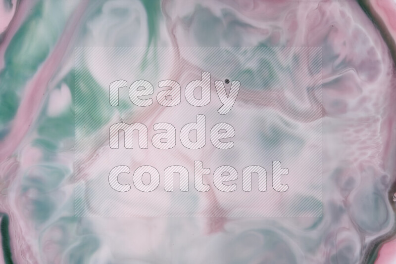 A close-up of abstract swirling patterns in red and green