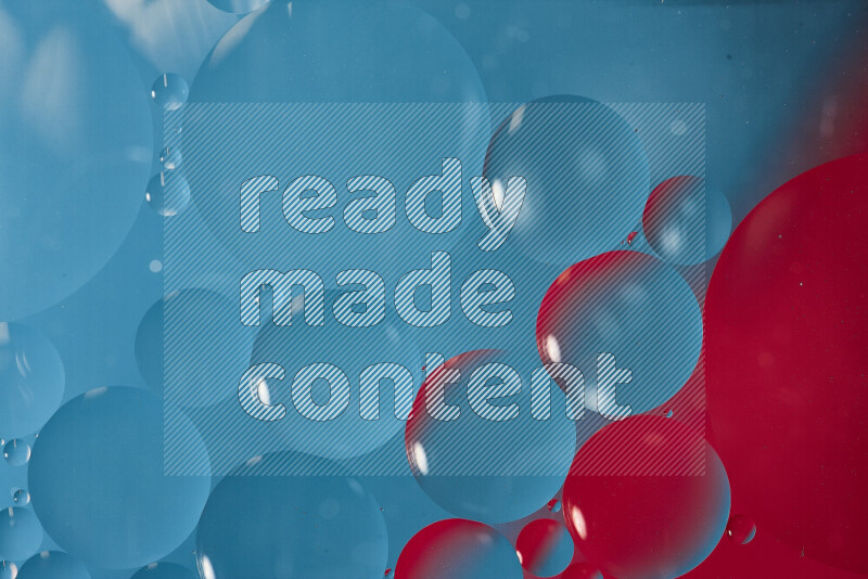 Close-ups of abstract oil bubbles on water surface in shades of blue and pink