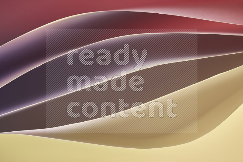 This image showcases an abstract paper art composition with paper curves in yellow, red and brown gradients created by colored light