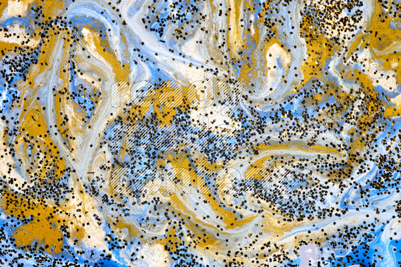 Abstract colorful background with mixed of blue, white and gold paint colors with scattered gold glitter
