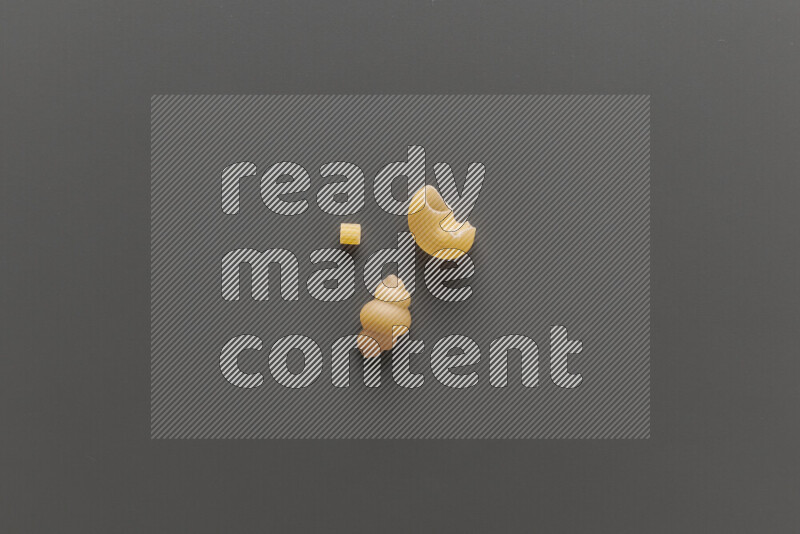 Different pasta types on grey background