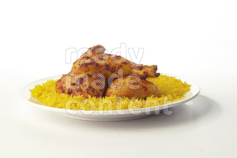 yellow basmati Rice with kabsa chicken pieces on a white rounded plate direct on white background