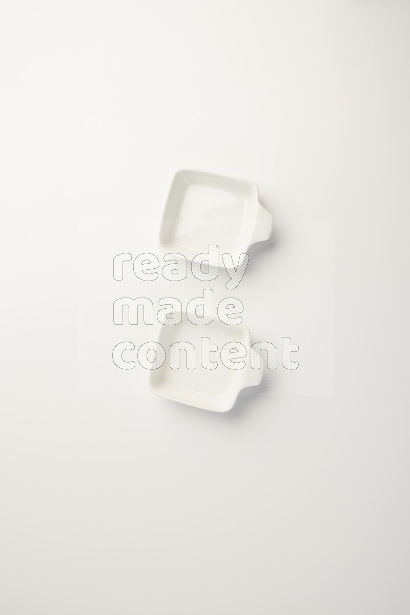 white ceramic square sauce dish on white countertop