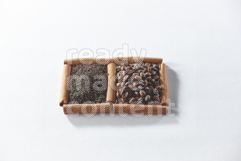 2 squares of cinnamon sticks full of coffee beans and black tea on white flooring