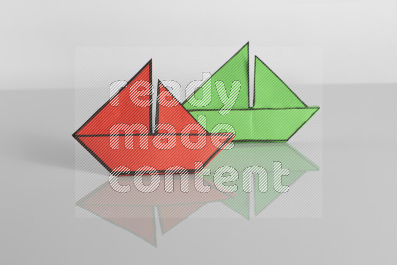 Origami boat on grey background