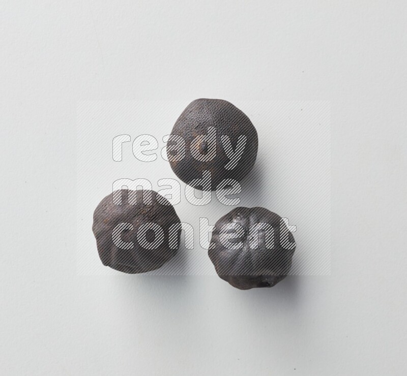 Top-view shot of dried lime (loomi) on white background