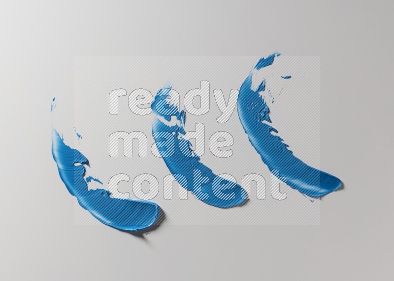 Blue painting knife strokes on white background