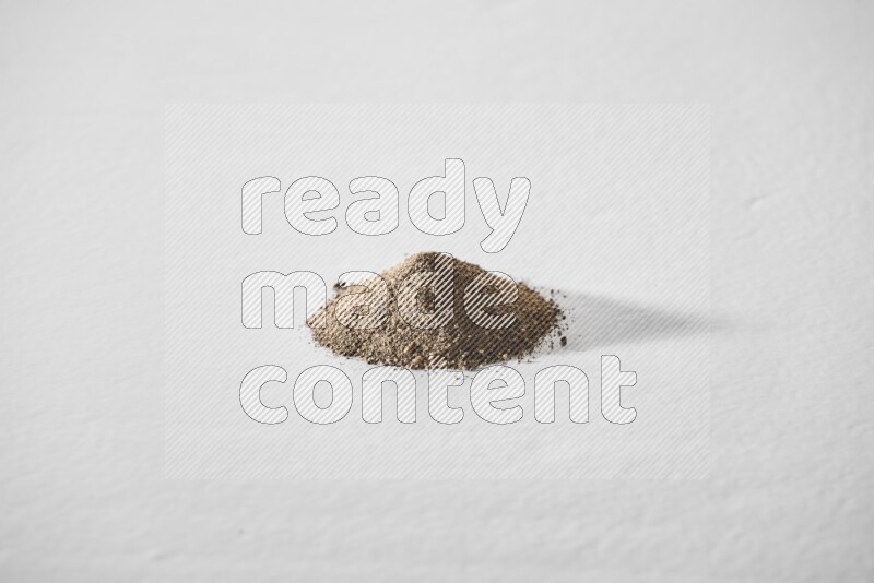 Black pepper powder on a white background