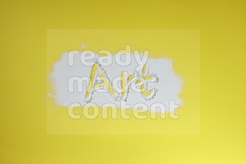 A word written with powder on yellow background