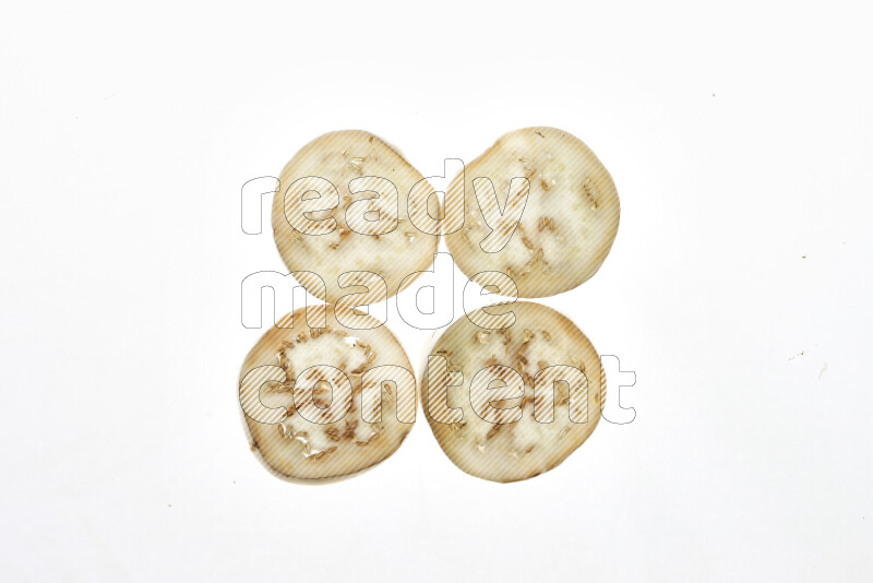 Eggplant slices on illuminated white background