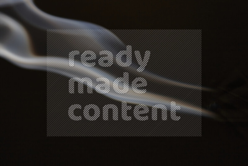 Motion of wavy smoke isolated on dark background