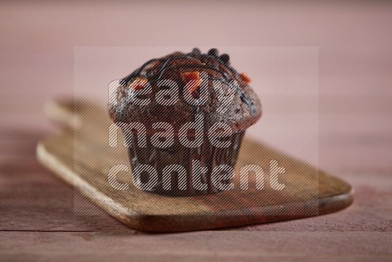 Chocolate cupcake on a wooden board