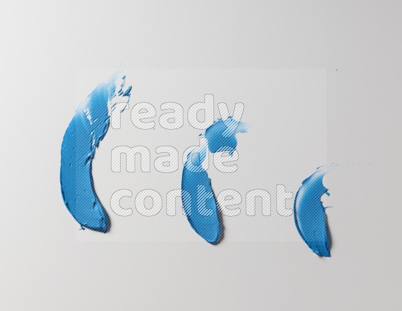 Blue painting knife strokes on white background