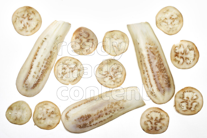Eggplant slices on illuminated white background