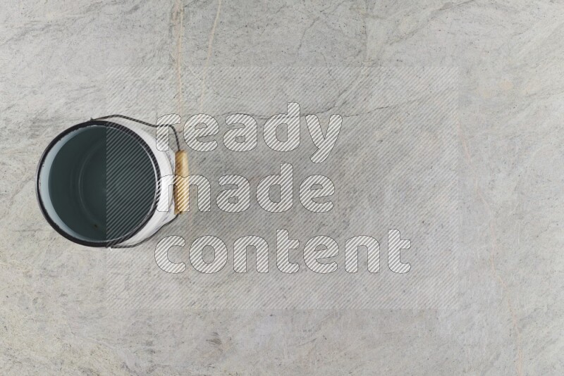 A vintage milk can on grey marble background