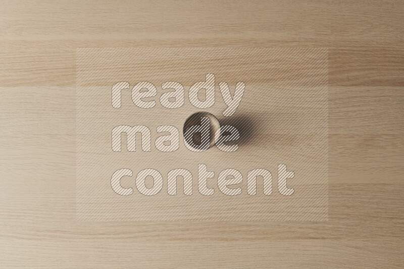 A pottery cup on light wooden background