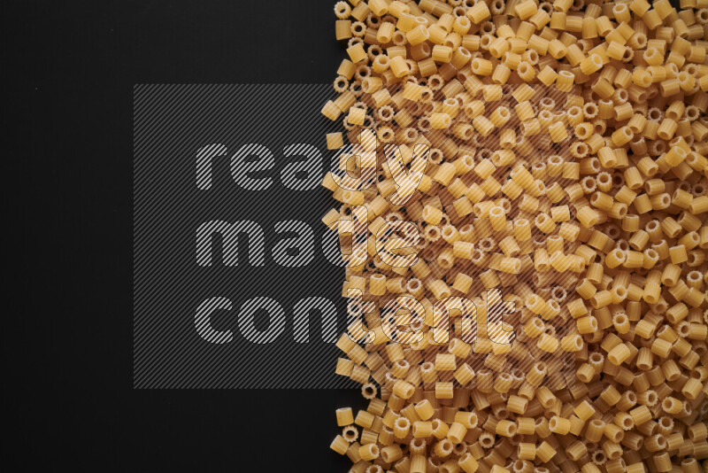 Different pasta types on black background