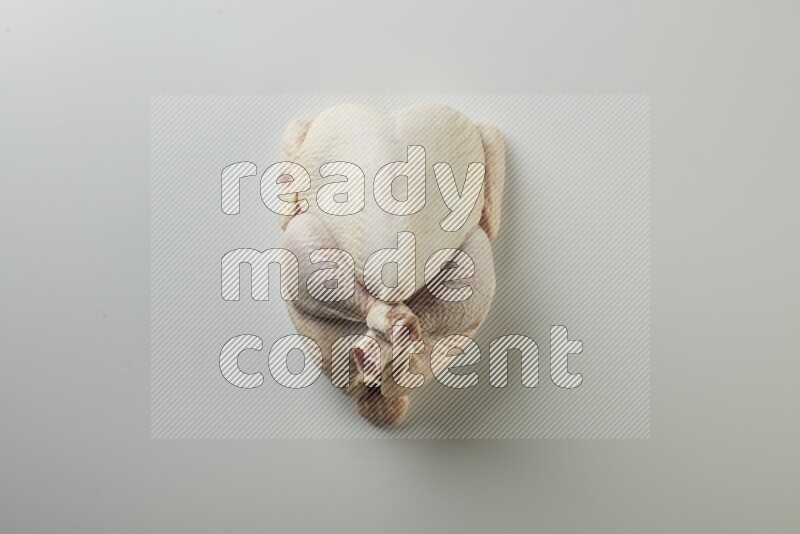 Whole fresh chicken direct on a white background