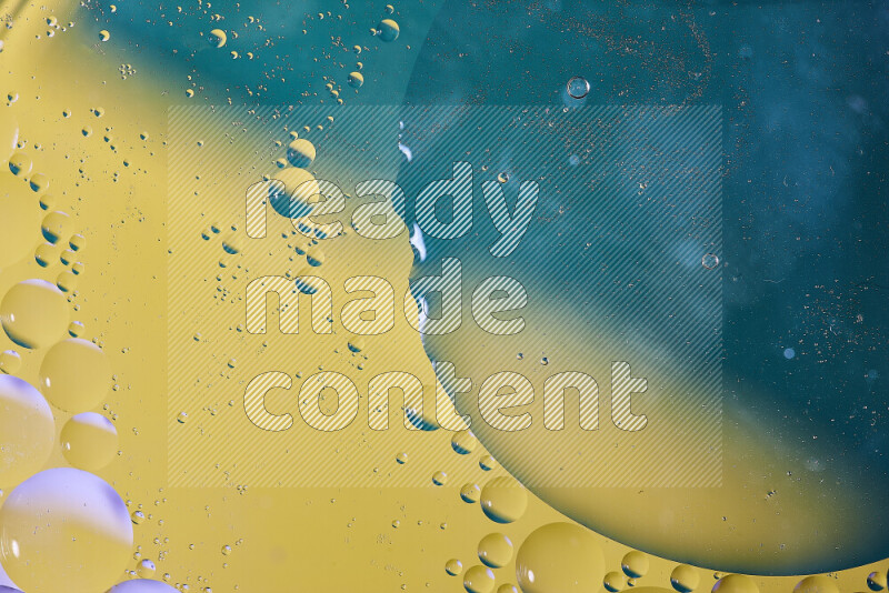 Close-ups of abstract oil bubbles on water surface in shades of blue and yellow