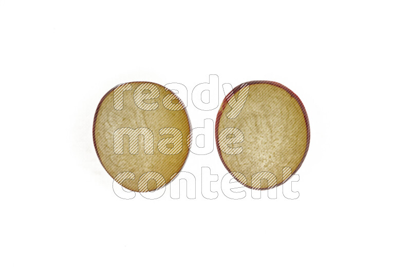 Plum slices on illuminated white background