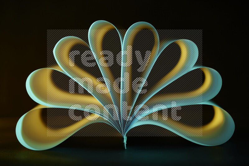 An abstract art piece displaying smooth curves in yellow and green gradients created by colored light