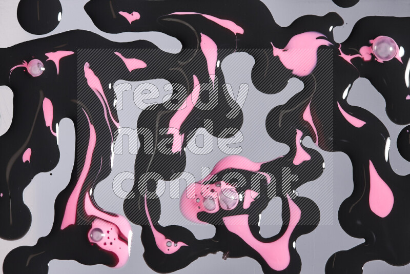 Abstract colorful background with mixed of pink and black paint colors