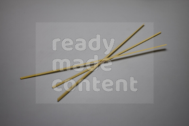 Linguini pasta on grey background