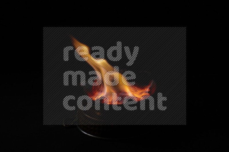 Coal cubes on fire in metal pan