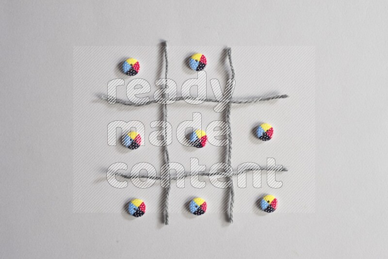 Multicolored buttons placed on grey background