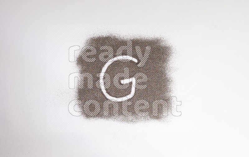 Alphabets written with glitter on white background