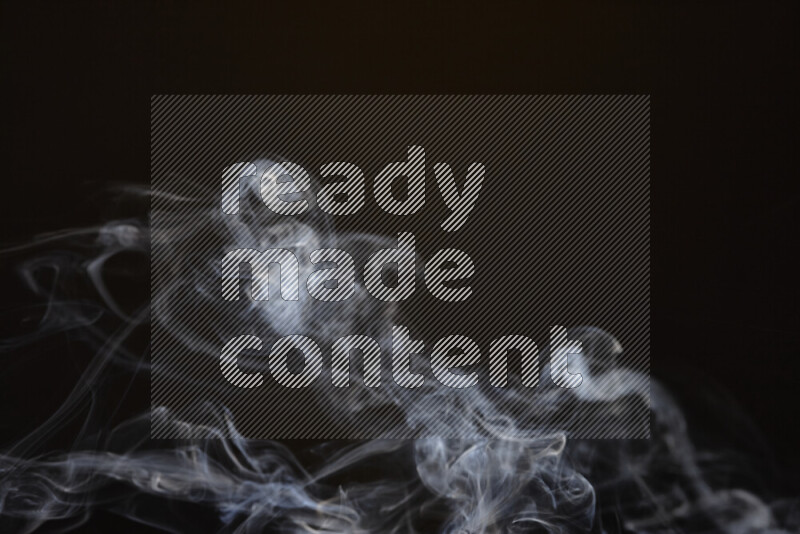 Motion of wavy smoke isolated on dark background