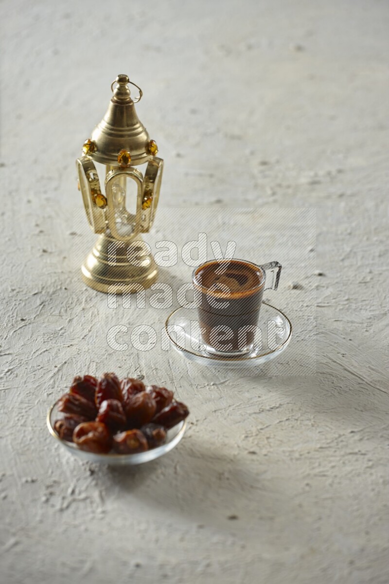 A golden lantern with different drinks, dates, nuts, prayer beads and quran on textured white background