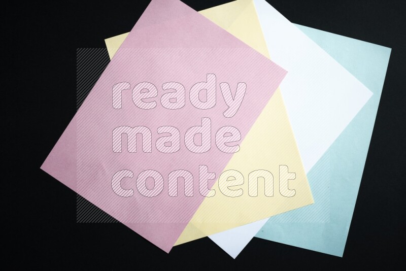 Multicolored paper sheet on black background