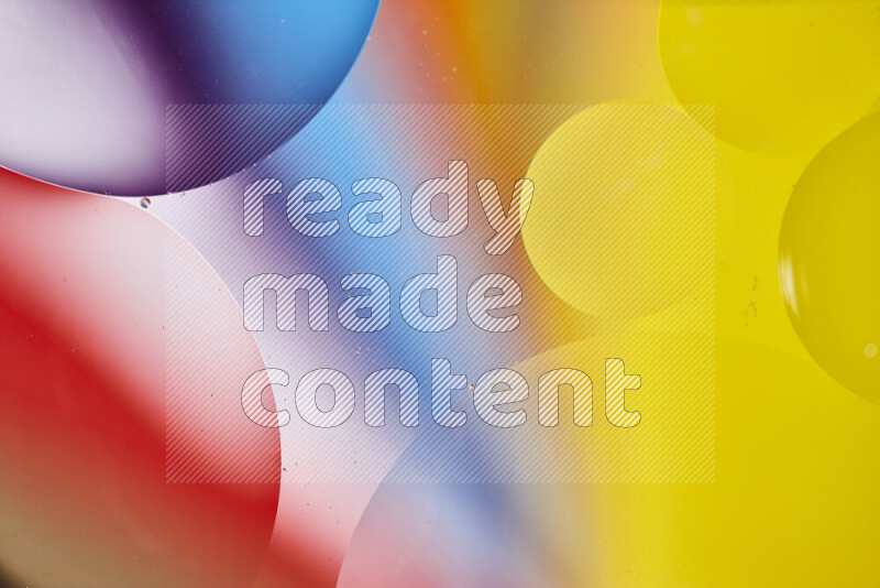 Close-ups of abstract oil bubbles on water surface in multicolors