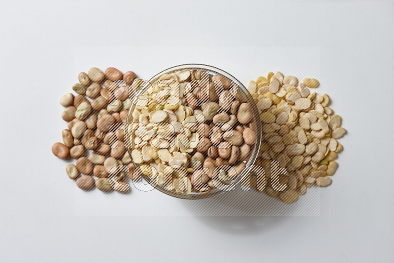 Fava beans with crushed beans on white background
