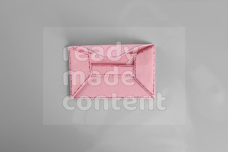 Origami envelope on grey background