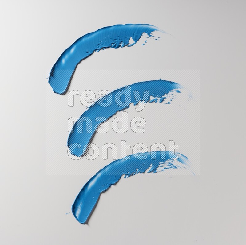 Blue painting knife strokes on white background