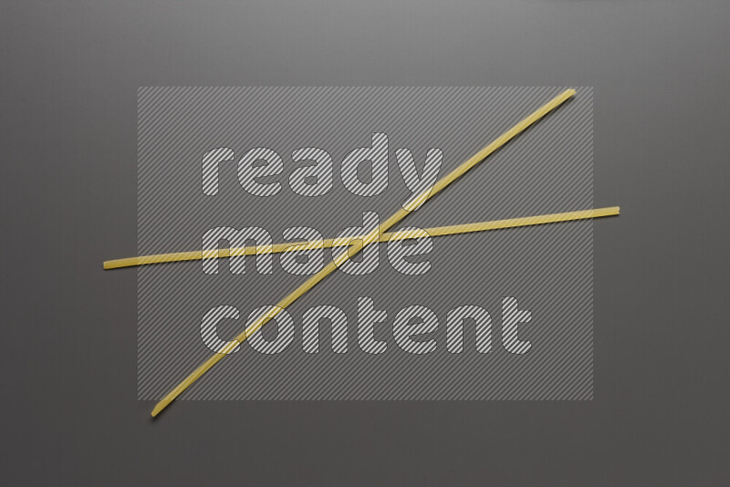 Linguini pasta on grey background