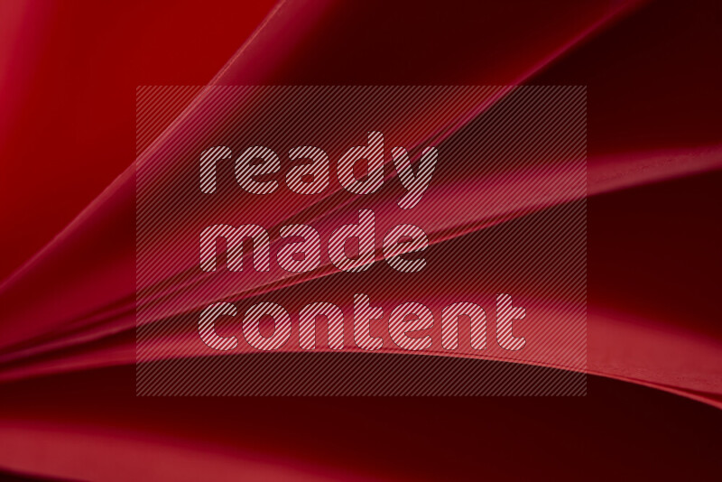 An abstract art showing red paper sheets arranged in an overlapping curves