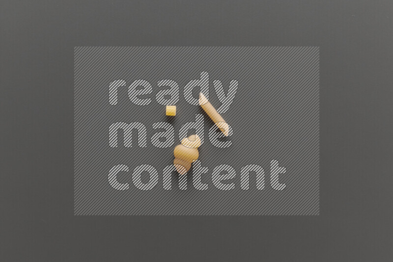 Different pasta types on grey background